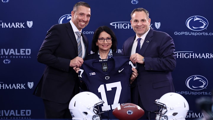 Matt Campbell, left, Penn State University president Neeli Bendapudi, middle, and Penn State University athletic director Pat Kraft, right, pose for a photo after Campbell is announced as the Penn State Nittany Lions new head coach. Matt Campbell, left, Penn State University president Neeli Bendapudi, middle, and Penn State University athletic director Pat Kraft, right, pose for a photo after Campbell is announced as the Penn State Nittany Lions new head coach.