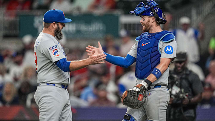 Sep 10, 2025; Cumberland, Georgia, USA; Chicago Cubs relief pitcher Andrew Kittredge (59) and catcher Carson Kelly (15) react after defeating the Atlanta Braves at Truist Park. Mandatory Credit: Dale Zanine-Imagn Images