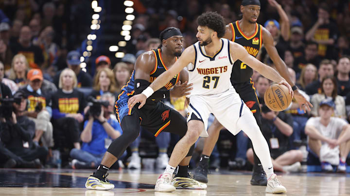 May 5, 2025; Oklahoma City, Oklahoma, USA; Oklahoma City Thunder guard Luguentz Dort (5) defends Denver Nuggets guard Jamal Murray (27) during the second half in game one of the second round for the 2025 NBA Playoffs at Paycom Center. Mandatory Credit: Alonzo Adams-Imagn Images May 5, 2025; Oklahoma City, Oklahoma, USA; Oklahoma City Thunder guard Luguentz Dort (5) defends Denver Nuggets guard Jamal Murray (27) during the second half in game one of the second round for the 2025 NBA Playoffs at Paycom Center. Mandatory Credit: Alonzo Adams-Imagn Images