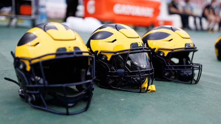 Michigan Wolverines helmets sit on the field Mandatory Credit: Matt Pendleton-Imagn Images