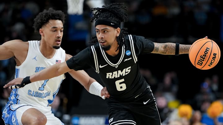 Mar 19, 2026; Greenville, SC, USA; VCU Rams guard Terrence Hill Jr. (6) dribbles the ball against North Carolina Tar Heels guard Seth Trimble (7) in the first half of a first round game of the men's 2026 NCAA Tournament at Bon Secours Wellness Arena. Mandatory Credit: Bob Donnan-Imagn Images