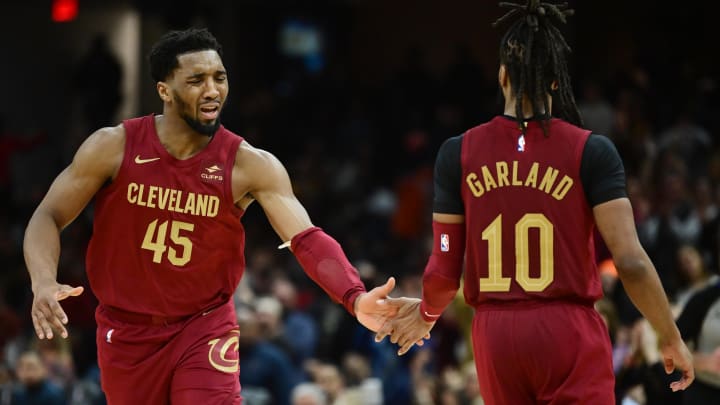 Feb 14, 2024; Cleveland, Ohio, USA; Cleveland Cavaliers guard Donovan Mitchell (45) celebrates with guard Darius Garland (10) during the second half against the Chicago Bulls at Rocket Mortgage FieldHouse. Mandatory Credit: Ken Blaze-USA TODAY Sports