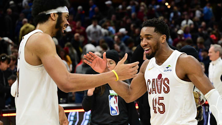 Jan 8, 2025; Cleveland, Ohio, USA; Cleveland Cavaliers guard Donovan Mitchell (45) celebrates with center Jarrett Allen (31) after the Cavaliers beat the Oklahoma City Thunder at Rocket Mortgage FieldHouse. Mandatory Credit: Ken Blaze-Imagn Images