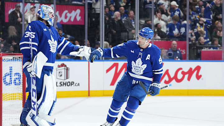 Dec 15, 2024; Toronto, Ontario, CAN; Toronto Maple Leafs center John Tavares (91) scores a goal and celebrates with the goaltender Dennis Hildeby (35) against the Buffalo Sabres during the second period at Scotiabank Arena. Mandatory Credit: Nick Turchiaro-Imagn Images Dec 15, 2024; Toronto, Ontario, CAN; Toronto Maple Leafs center John Tavares (91) scores a goal and celebrates with the goaltender Dennis Hildeby (35) against the Buffalo Sabres during the second period at Scotiabank Arena. Mandatory Credit: Nick Turchiaro-Imagn Images
