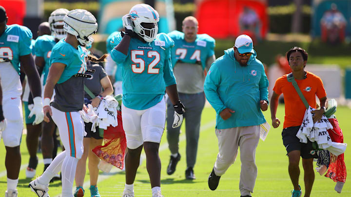 Miami Dolphins offensive tackle Patrick Paul (52) walks on the field during joint practice with the Washington Commanders at Baptist Health Training Complex.