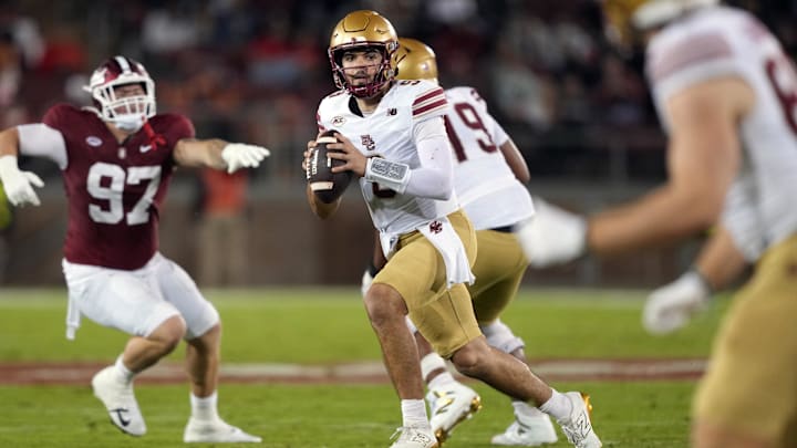 Sep 13, 2025; Stanford, California, USA; Boston College Eagles quarterback Dylan Lonergan (center) scrambles against the Stanford Cardinal during the third quarter at Stanford Stadium. Mandatory Credit: Darren Yamashita-Imagn Images Sep 13, 2025; Stanford, California, USA; Boston College Eagles quarterback Dylan Lonergan (center) scrambles against the Stanford Cardinal during the third quarter at Stanford Stadium. Mandatory Credit: Darren Yamashita-Imagn Images