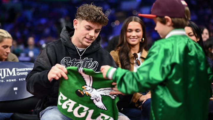 Philadelphia Eagles Cooper DeJean interacts with fans during the game between the Philadelphia 76ers and the Toronto Raptors. Philadelphia Eagles Cooper DeJean interacts with fans during the game between the Philadelphia 76ers and the Toronto Raptors.