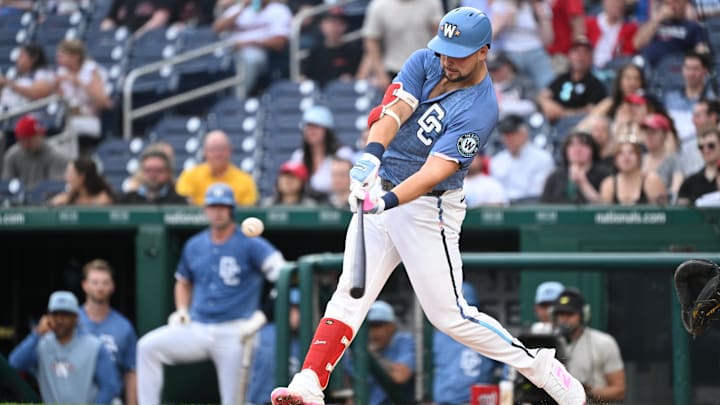 Jun 6, 2025; Washington, District of Columbia, USA; Washington Nationals first baseman Nathaniel Lowe (33) hits a single during the second inning against the Texas Rangers at Nationals Park. Mandatory Credit: Rafael Suanes-Imagn Images