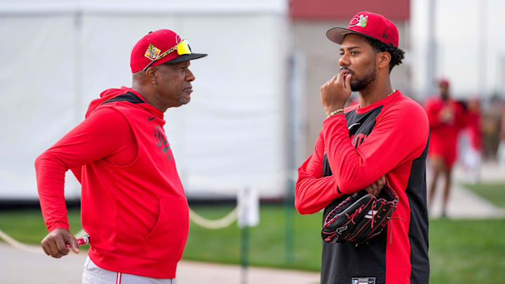 Cincinnati Reds pitcher Hunter Greene (21) talks with special assistant to the general manager, Eric Davis, at the Cincinnati Reds player development complex in Goodyear, Ariz., on Wednesday, Feb. 11, 2026. Cincinnati Reds pitcher Hunter Greene (21) talks with special assistant to the general manager, Eric Davis, at the Cincinnati Reds player development complex in Goodyear, Ariz., on Wednesday, Feb. 11, 2026.