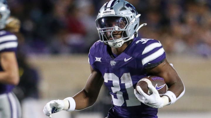 Nov 16, 2024; Manhattan, Kansas, USA; Kansas State Wildcats running back DJ Giddens (31) runs the ball against the Arizona State Sun Devils during the third quarter at Bill Snyder Family Football Stadium. Mandatory Credit: Scott Sewell-Imagn Images