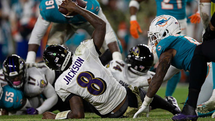 Baltimore Ravens quarterback Lamar Jackson (8), is sacked during fourth quarter action of their NFL game at Hard Rock Stadium Thursday in Miami Gardens in 2021.