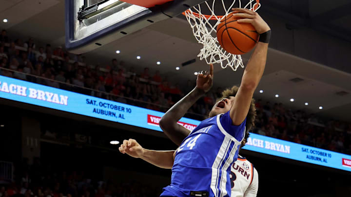 Feb 21, 2026; Auburn, Alabama, USA;  Kentucky Wildcats center Malachi Moreno (24) grabs a rebound against the Auburn Tigers during the first half at Neville Arena. Mandatory Credit: John Reed-Imagn Images