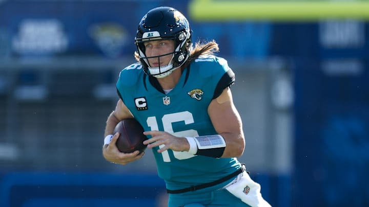 Dec 1, 2024; Jacksonville, Florida, USA; Jacksonville Jaguars quarterback Trevor Lawrence (16) runs with the ball against the Houston Texans in the second quarter at EverBank Stadium. Mandatory Credit: Nathan Ray Seebeck-Imagn Images