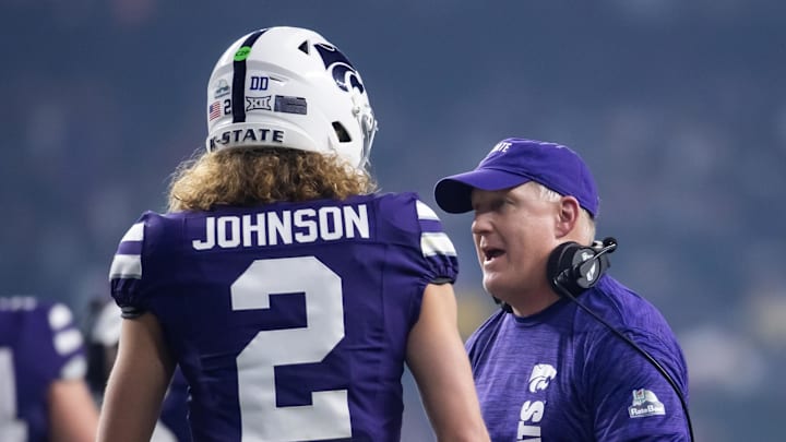 Dec 26, 2024; Phoenix, AZ, USA; Kansas State Wildcats head coach Chris Klieman with quarterback Avery Johnson (2) against the Rutgers Scarlet Knights during the Rate Bowl at Chase Field. Mandatory Credit: Mark J. Rebilas-Imagn Images Dec 26, 2024; Phoenix, AZ, USA; Kansas State Wildcats head coach Chris Klieman with quarterback Avery Johnson (2) against the Rutgers Scarlet Knights during the Rate Bowl at Chase Field. Mandatory Credit: Mark J. Rebilas-Imagn Images
