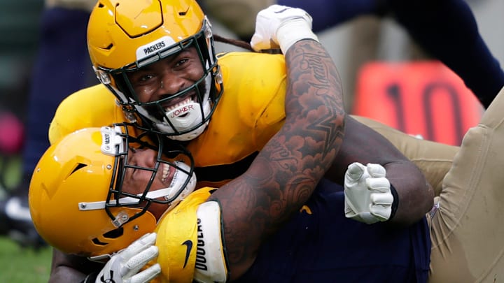 Za'Darius Smith and Preston Smith embrace during a 2019 game with the Packers.