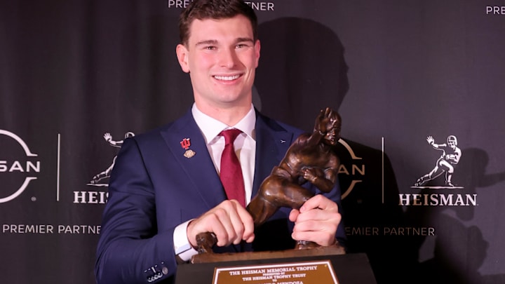 Indiana Hoosiers quarterback Fernando Mendoza poses with the Heisman trophy at the New York Marriott Marquis. Indiana Hoosiers quarterback Fernando Mendoza poses with the Heisman trophy at the New York Marriott Marquis.