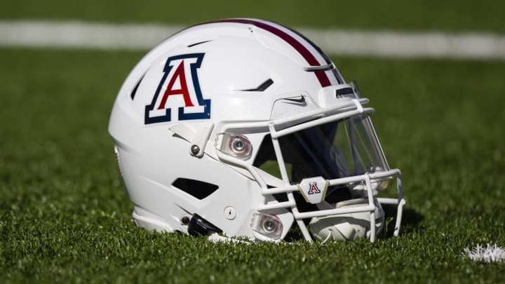 Nov 25, 2022; Tucson, Arizona, USA; Detailed view of an Arizona Wildcats helmet on the field during the Territorial Cup at Arizona Stadium. Nov 25, 2022; Tucson, Arizona, USA; Detailed view of an Arizona Wildcats helmet on the field during the Territorial Cup at Arizona Stadium.
