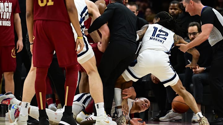 Feb 23, 2025; Cleveland, Ohio, USA; Cleveland Cavaliers and Memphis Grizzlies players scuffle after a play during the second half at Rocket Arena. Feb 23, 2025; Cleveland, Ohio, USA; Cleveland Cavaliers and Memphis Grizzlies players scuffle after a play during the second half at Rocket Arena.