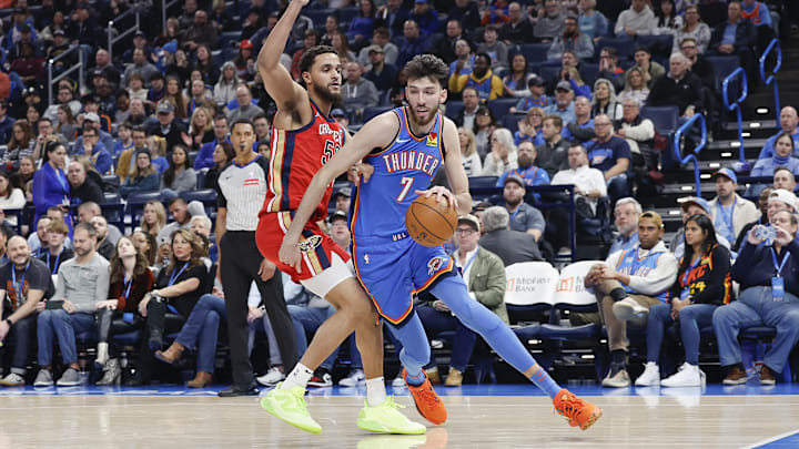 Feb 10, 2025; Oklahoma City, Oklahoma, USA; Oklahoma City Thunder forward Chet Holmgren (7) drives around New Orleans Pelicans forward Jeremiah Robinson-Earl (50) during the second quarter at Paycom Center.