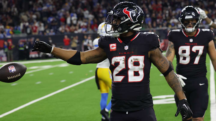 Houston Texans running back Joe Mixon (28) reacts to his rushing first down against the Los Angeles Chargers in the fourth quarter in an AFC wild card game at NRG Stadium.