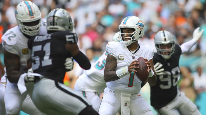 Nov 19, 2023; Miami Gardens, Florida, USA; Miami Dolphins quarterback Tua Tagovailoa (1) looks for a