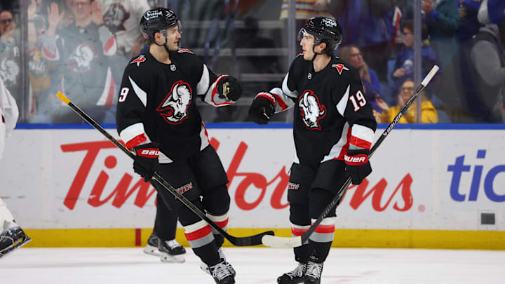 Apr 9, 2026; Buffalo, New York, USA;  Buffalo Sabres center Peyton Krebs (19) celebrates his goal with center Josh Norris (9) during the first period against the Columbus Blue Jackets at KeyBank Center. Mandatory Credit: Timothy T. Ludwig-Imagn Images