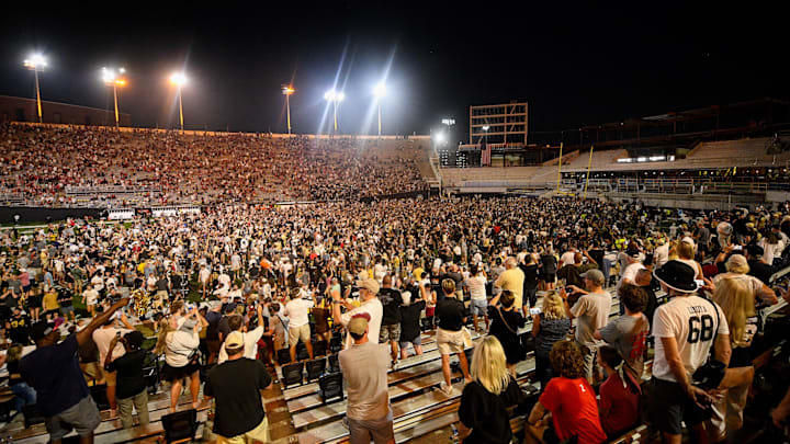 Oct 5, 2024; Nashville, Tennessee, USA;  Vanderbilt Commodores fans rush the field after a victory over the Alabama Crimson Tide at FirstBank Stadium. Mandatory Credit: Steve Roberts-Imagn Images