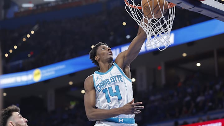 Mar 21, 2025; Oklahoma City, Oklahoma, USA; Charlotte Hornets forward Moussa Diabate (14) dunks against the Oklahoma City Thunder during the second half at Paycom Center. Mandatory Credit: Alonzo Adams-Imagn Images