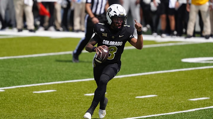 Sep 6, 2025; Boulder, Colorado, USA; Colorado Buffaloes quarterback Kaidon Salter (3) scrambles for a touchdown in the first quarter against the Delaware Fightin Blue Hens at Folsom Field. Mandatory Credit: Ron Chenoy-Imagn Images