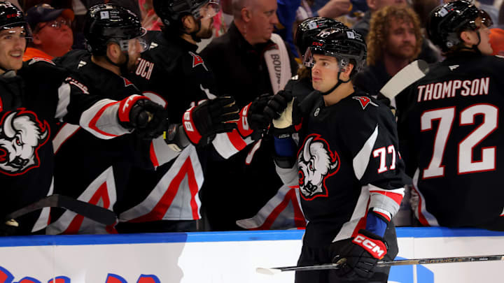 Apr 8, 2025; Buffalo, New York, USA;  Buffalo Sabres right wing JJ Peterka (77) celebrates his goal with teammates during the third period against the Carolina Hurricanes at KeyBank Center. Mandatory Credit: Timothy T. Ludwig-Imagn Images