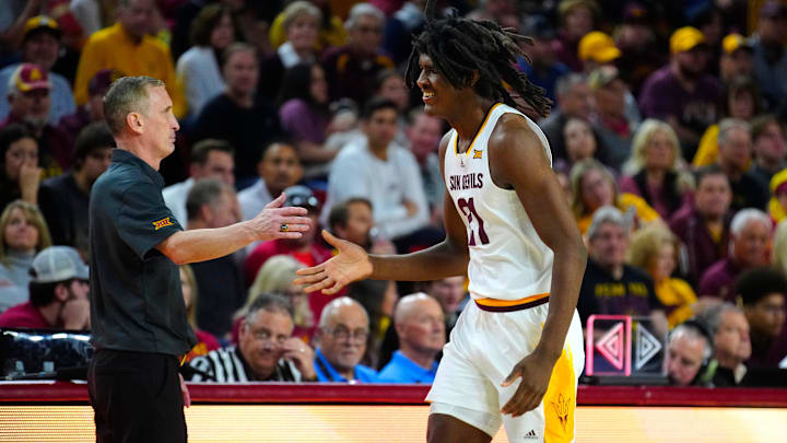 ASU head coach Bobby Hurley high-fives center Jayden Quaintance (21) as he comes to the bench during a game at Desert Financial Arena in Tempe on Jan. 25, 2025. ASU head coach Bobby Hurley high-fives center Jayden Quaintance (21) as he comes to the bench during a game at Desert Financial Arena in Tempe on Jan. 25, 2025.
