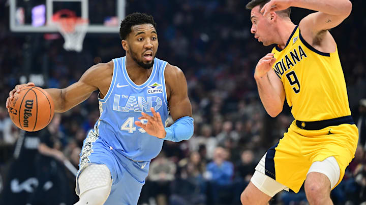 Jan 12, 2025; Cleveland, Ohio, USA; Cleveland Cavaliers guard Donovan Mitchell (45) drives to the basket against Indiana Pacers guard T.J. McConnell (9) during the first half at Rocket Mortgage FieldHouse. Mandatory Credit: Ken Blaze-Imagn Images Jan 12, 2025; Cleveland, Ohio, USA; Cleveland Cavaliers guard Donovan Mitchell (45) drives to the basket against Indiana Pacers guard T.J. McConnell (9) during the first half at Rocket Mortgage FieldHouse. Mandatory Credit: Ken Blaze-Imagn Images