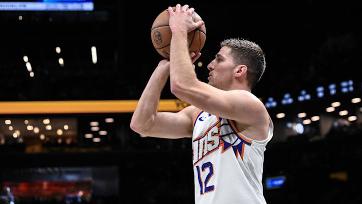 Jan 19, 2026; Brooklyn, New York, USA; Phoenix Suns guard Collin Gillespie (12) shoots the ball during the second half against the Brooklyn Nets at Barclays Center. Mandatory Credit: John Jones-Imagn Images