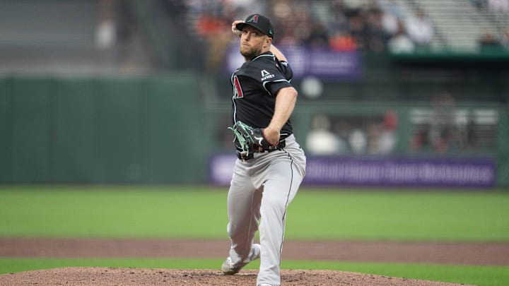 May 12, 2025; San Francisco, California, USA; Arizona Diamondbacks starting pitcher Merrill Kelly (29) delivers a pitch against the San Francisco Giants during the first inning at Oracle Park. Mandatory Credit: Neville E. Guard-Imagn Images
