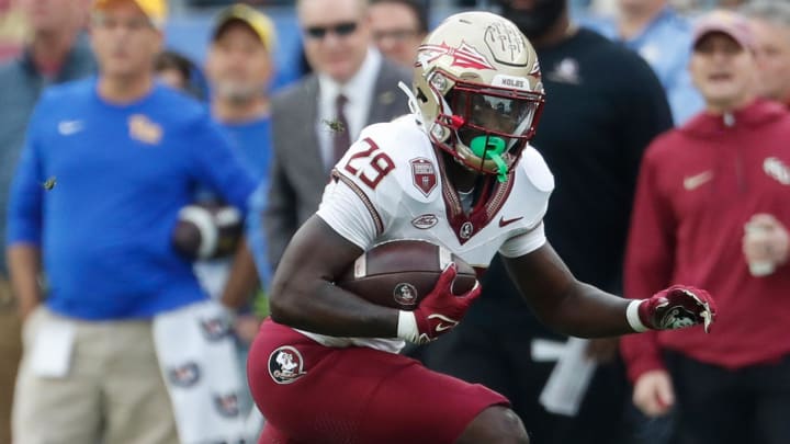 Nov 4, 2023; Pittsburgh, Pennsylvania, USA; Florida State Seminoles running back Rodney Hill (29) runs after a catch against the Pittsburgh Panthers during the first quarter at Acrisure Stadium. Mandatory Credit: Charles LeClaire-USA TODAY Sports Nov 4, 2023; Pittsburgh, Pennsylvania, USA; Florida State Seminoles running back Rodney Hill (29) runs after a catch against the Pittsburgh Panthers during the first quarter at Acrisure Stadium. Mandatory Credit: Charles LeClaire-USA TODAY Sports