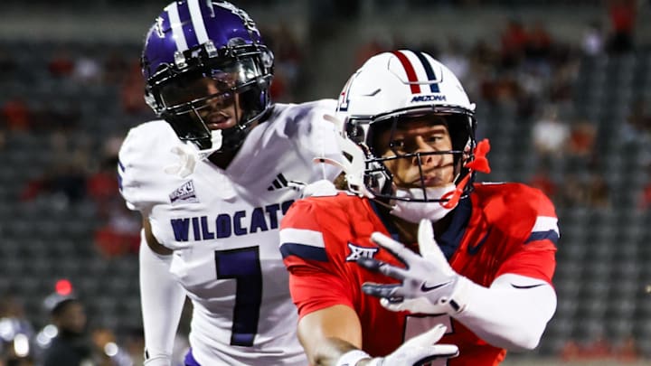 Sep 6, 2025; Tucson, Arizona, USA; Arizona Wildcats wide receiver Gio Richardson (5) fails to catch the ball while Weber State Wildcats center back Tre Parks-Vinson (7) watches from behind during the second quarter of the game at Arizona Stadium. Mandatory Credit: Aryanna Frank-Imagn Images