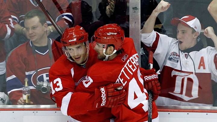 DEC 10, 2010; Detroit, MI, USA; Detroit Red Wings center Pavel Datsyuk (13) scores a second period goal and is congratulated by teammate center Henrik Zetterberg (40) during the game against the Montreal Canadiens at Joe Louis Arena in Detroit, Michigan. Mandatory Credit: Leon Halip-USA TODAY Sports