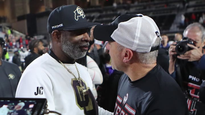 Nov 9, 2024; Lubbock, Texas, USA; Colorado Buffaloes head coach Deion Sanders and Texas Tech Red Raiders head coach Joey McGuire after the game at Jones AT&T Stadium and Cody Campbell Field. Mandatory Credit: Michael C. Johnson-Imagn Images