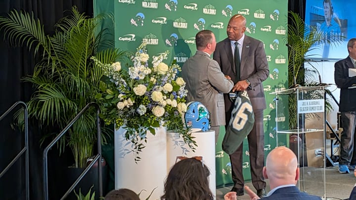 New Football Head Coach Will Hall Shakes AD David Harris' Hands New Football Head Coach Will Hall Shakes AD David Harris' Hands