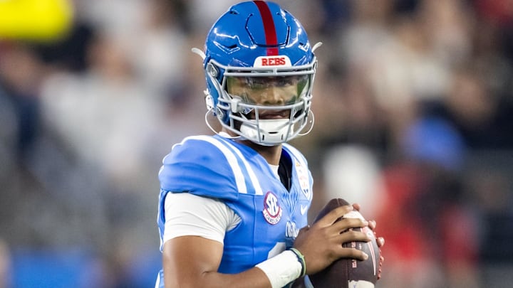 Jan 8, 2026; Glendale, AZ, USA; Mississippi Rebels quarterback Austin Simmons (13) against the Miami Hurricanes during the 2026 Fiesta Bowl and semifinal game of the College Football Playoff at State Farm Stadium. Mandatory Credit: Mark J. Rebilas-Imagn Images
