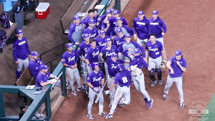 Feb. 20, 2025-TCU Baseball players celebrate a home run hit by Isaac Cadena (8) at Globe Life Field.