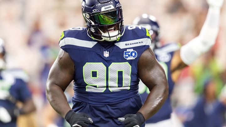 Sep 25, 2025; Glendale, Arizona, USA; Seattle Seahawks tackle Jarran Reed (90) reacts against the Arizona Cardinals at State Farm Stadium.