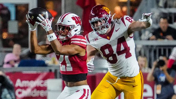 Wisconsin Badgers safety Cairo Skanes (21) intercepts a pass intended for USC Trojans tight end Tucker Ashcraft (84) during their game Oct. 24, 2026, at Camp Randall Stadium in Madison, Wisconsin.