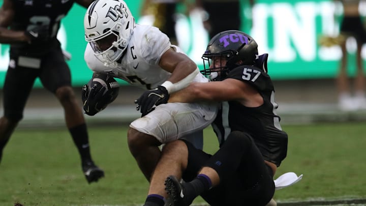 TCU Linebacker Johnny Hodges making a tackle TCU Linebacker Johnny Hodges making a tackle
