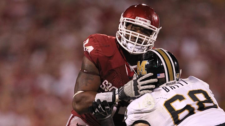 Sep 24, 2011; Norman, OK, USA; Oklahoma Sooners defensive end Frank Alexander (84) rushes the passer against Missouri Tigers tackle Justin Britt (68) at Oklahoma Memorial Stadium. The Sooners beat the Tigers 38-28. Mandatory Credit: Matthew Emmons-Imagn Images
