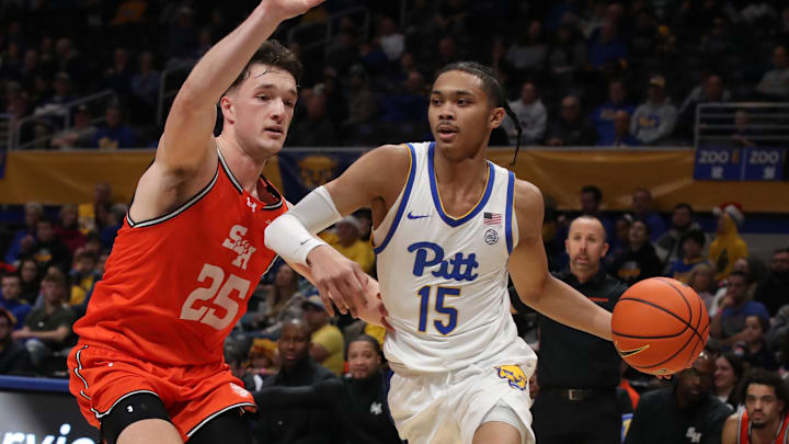 Dec 21, 2024; Pittsburgh, Pennsylvania, USA; Pittsburgh Panthers guard Jaland Lowe (15) drives the baseline against Sam Houston State Bearkats forward Cameron Huefner (25) during the first half at the Petersen Events Center. Mandatory Credit: Charles LeClaire-Imagn Images Dec 21, 2024; Pittsburgh, Pennsylvania, USA; Pittsburgh Panthers guard Jaland Lowe (15) drives the baseline against Sam Houston State Bearkats forward Cameron Huefner (25) during the first half at the Petersen Events Center. Mandatory Credit: Charles LeClaire-Imagn Images