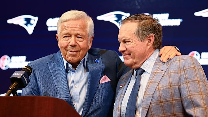 Jan 11, 2024; Foxborough, MA, USA; New England Patriots former head coach Bill Belichick (right) embraces Patriots owner Robert Kraft (left) during a press conference at Gillette Stadium to announce Belichick's exit from the team. Mandatory Credit: Eric Canha-Imagn Images