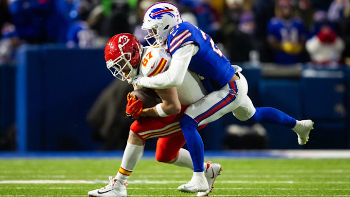 Jan 21, 2024; Orchard Park, New York, USA; Kansas City Chiefs tight end Travis Kelce (87) is tackled by Buffalo Bills safety Jordan Poyer (21) in the 2024 AFC divisional round game