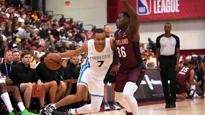 Jul 13, 2022; Las Vegas, NV, USA; Charlotte Hornets forward Bryce McGowens (7) dribbles against Cleveland Cavaliers guard Amauri Hardy (36) during an NBA Summer League game at Cox Pavilion. Mandatory Credit: Stephen R. Sylvanie-Imagn Images Jul 13, 2022; Las Vegas, NV, USA; Charlotte Hornets forward Bryce McGowens (7) dribbles against Cleveland Cavaliers guard Amauri Hardy (36) during an NBA Summer League game at Cox Pavilion. Mandatory Credit: Stephen R. Sylvanie-Imagn Images