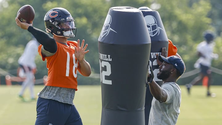 Caleb Williams works on passing through dummies to simulate the pass rush.